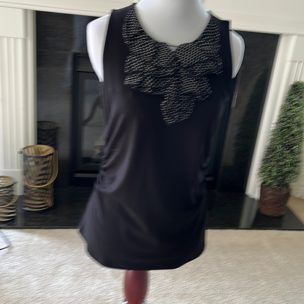Black top hip length sleeveless ruched sides